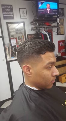 Bearded client after a beard trim and haircut at Ernie's Barber Shop